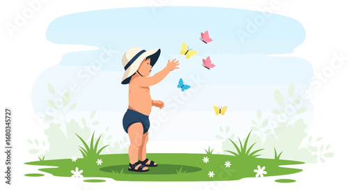 Adorable baby reaching for butterflies in a sunny meadow on a bright day