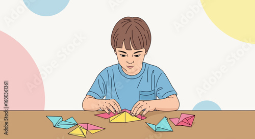 A Young Boy Focused on Folding Colorful Origami Paper Arts on a Table and Creating Figures