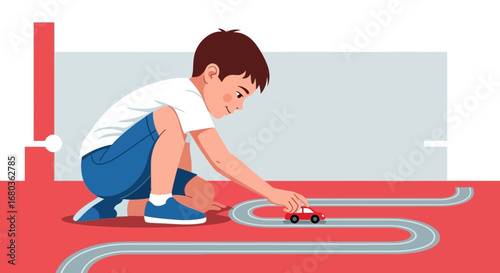 A young boy playing with a toy car on a race track