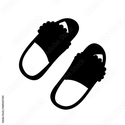 Black silhouette vector illustration of two fuzzy slippers isolated on white