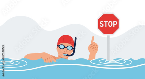 Swimming Stop Sign Concept: Swimmer Pointing At A Stop Sign Demonstrating Safety