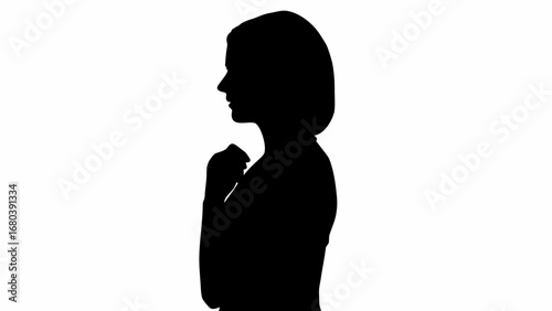 Silhouette of a woman with hands clasped looking thoughtful against a white background in a studio shot