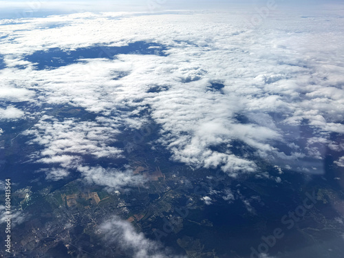 Clouds and sky as seen through window of an aircraft