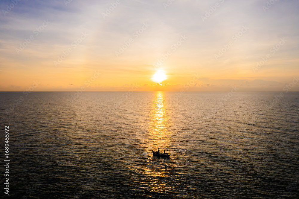 Obraz premium Aerial view of the beautiful seascape with boats floating in the sea and morning clouds.