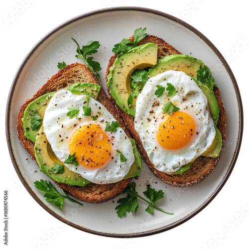 Two avocado toasts topped with fried eggs and parsley on a plate perfect for a healthy breakfast or brunch showcasing vibrant colors and fresh ingredients on transparent background
