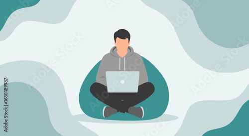 Young Professional Comfortably Using a Laptop While Seated on a Beanbag In Abstract Setting