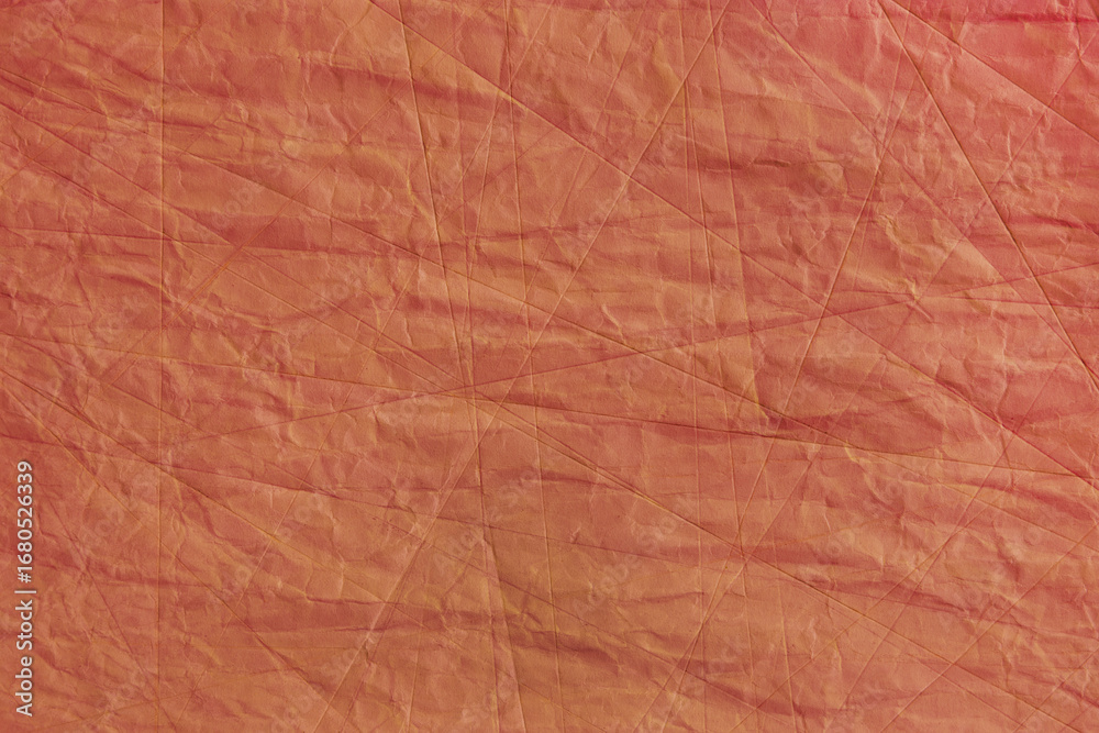 Fototapeta premium Abstract wrinkled orange crumpled paper texture background