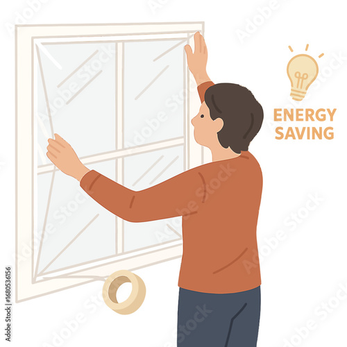 Energy efficient home: man using insulation film on window for heat conservation