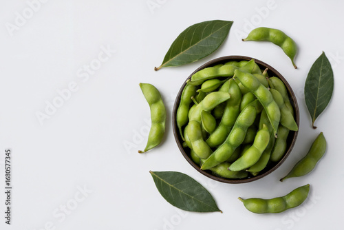 Wallpaper Mural Top down view of fresh green edamame pods in a bowl with leaves soybeans Torontodigital.ca