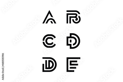 A collection of six stylized letters in black on a white background display