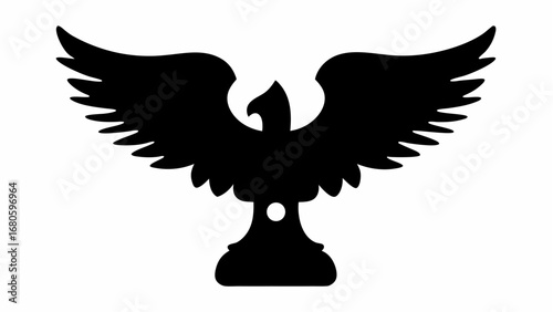 Silhouette of a bird with outstretched wings perched atop a decorative pedestal in stark black and white