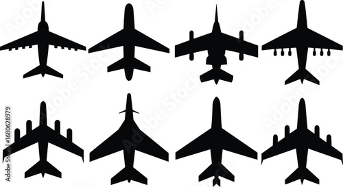 Silhouettes of eight different airplane models from top view, black vector icons, aircraft shapes, aviation and travel concept.
