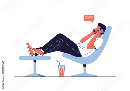 Man relaxing in a chair talking on the phone and listening to music with a drink nearby