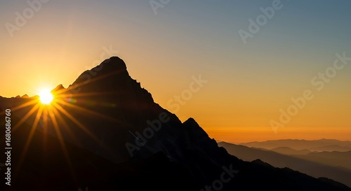 A stunning sunrise breaks over mountain peaks, symbolizing new beginnings, hope, and achieving goals. With copy space.