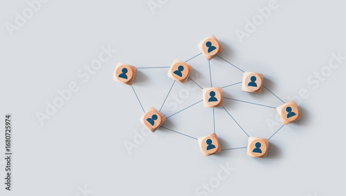 Organizational network structure with connected people icons on wooden blocks, showing team collaboration, stakeholder mapping, social graph, and business communication on a light background