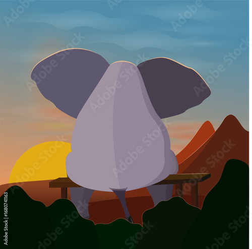 Back view of elephant watching mountain sunset