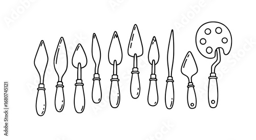 Collection of artist tools including palette knives and paint palette. Art, craft, painting, creative, tools, equipment, design, illustration, artist, supplies.
