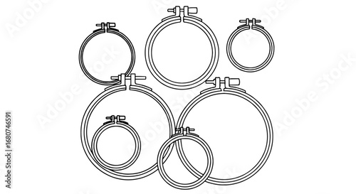 Embroidery hoops outline form a graphic arrangement. Art and craft tools, sewing equipment, hobby, handcrafted.