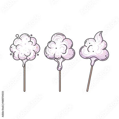 Three fluffy piles of pink cotton candy on sticks showing different shapes and designs