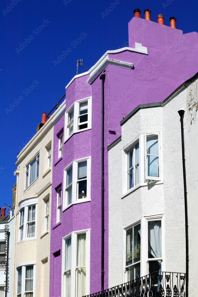 Fototapeta premium Colourful terraced town house residences in Brighton England UK, stock photo image, building and architecture travel destination stock photo image