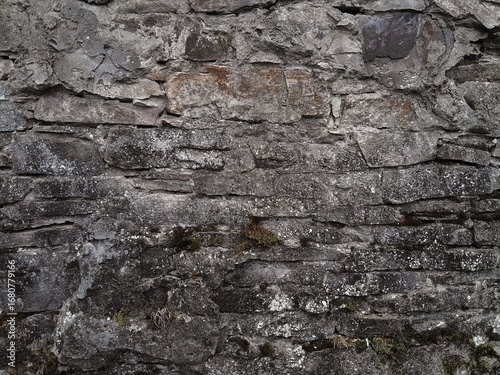 Background of very old stone wall texture photo