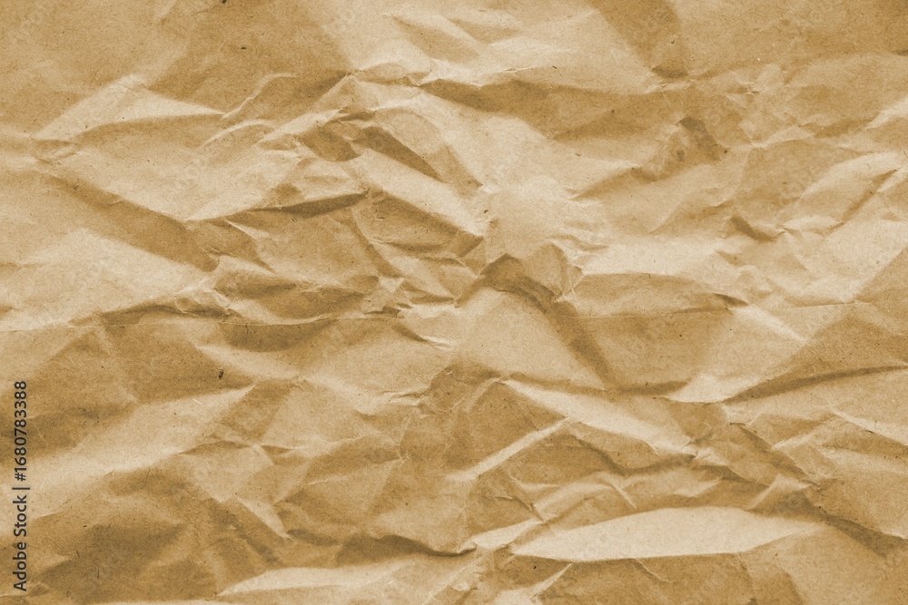 Fototapeta premium Brown crumpled recycled paper texture background. Kraft Paper