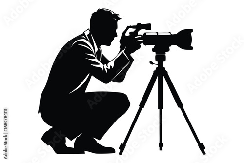 Silhouette of Photographer Squatting Adjusting a Camera on a Tripod, White Background