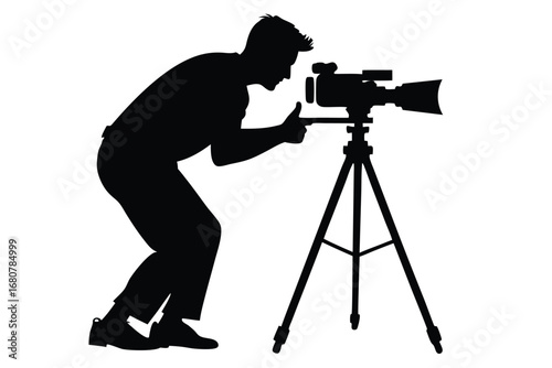 Cameraman Silhouette with Camera on Tripod Adjusting Focus on White Background