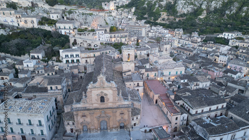 Sunny Modica from above – a baroque jewel of Sicily, with golden houses cascading down the hills and streets glowing in the Mediterranean light.