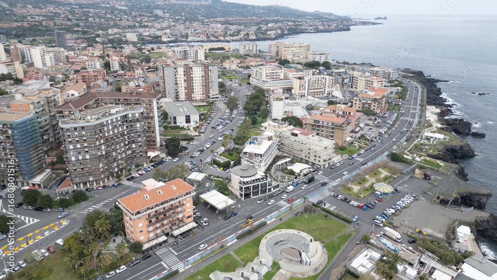 Fototapeta premium From above, Sicily reveals its maze of golden streets and stone houses – a timeless charm in the heart of the Mediterranean.