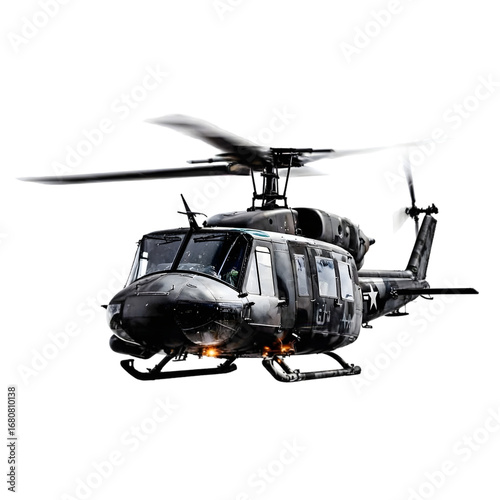 Black UH-1 Iroquois helicopter in flight