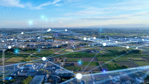 Fototapeta Naklejka Na Ścianę i Meble -  地方都市の空撮と通信ネットワークのコンセプト