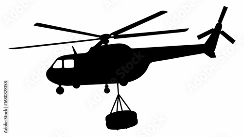 Silhouette of a helicopter carrying a cylindrical object suspended below it with cables in flight