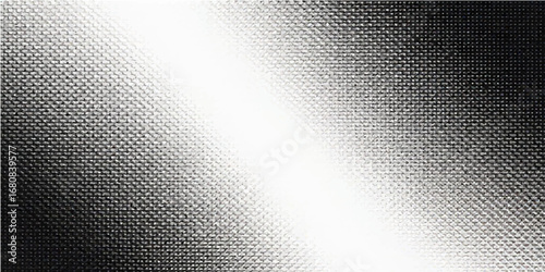 A textured gray brushed metallic surface with a dark carbon steel pattern