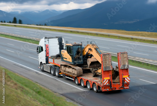 Heavy Machinery Equipment Transportation On Flatbed Trailer