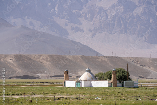 Obraz na plátně Scenic morning landscape view of bright white Murghab mosque, Gorno-Badakhshan,
