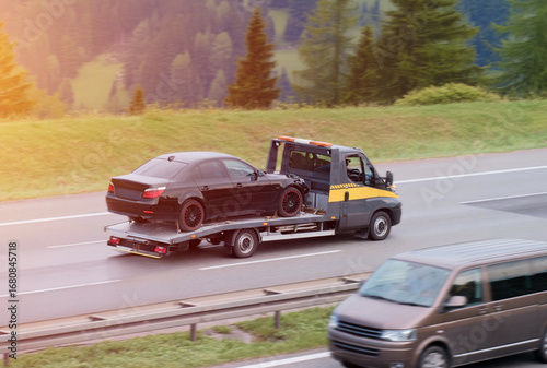 Disabled Car Vehicle On Tow Truck Flatbed