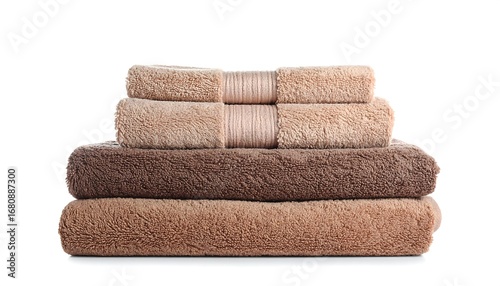 Stacked bath towels in varying shades of beige and brown