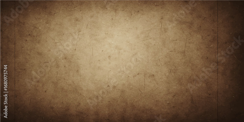 Vintage old brown parchment paper texture with a distressed, stained and worn grunge backdrop