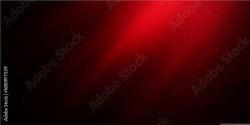 A spotlight shines on red stage curtains with a textured design