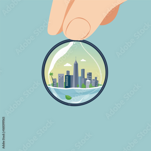 A magnifying glass is held over a single drop of water  revealing a miniature  clean  and sustainable city inside. Graphic illustration  clean defined shapes.