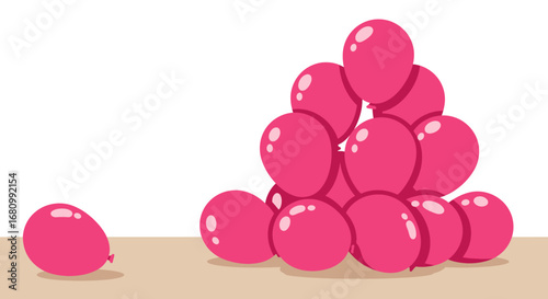 Pile of bright pink easter eggs stacked in a pyramid shape with one egg separate on the left