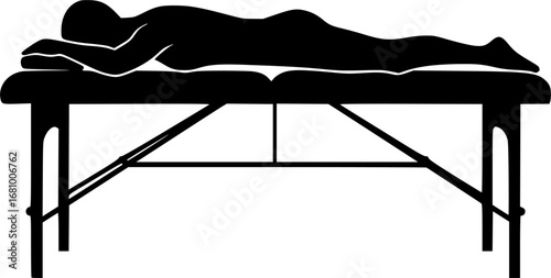 person lying on a massage table silhouette