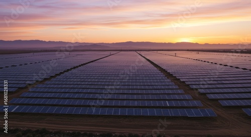 Golden Hour Over a Vast Solar Farm, Reflecting a Serene Purple and Orange Sky.
