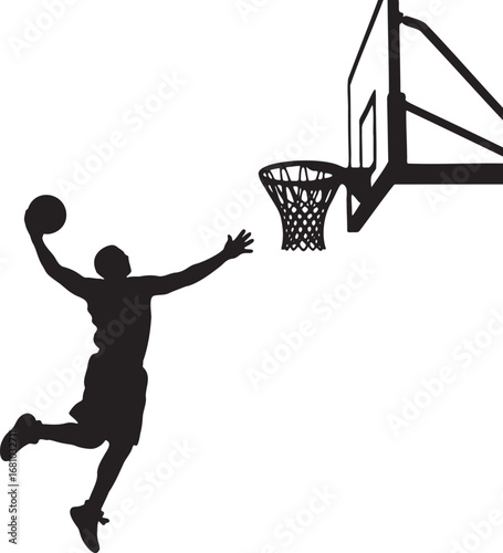 Black silhouette of basketball player dunking ball into hoop
