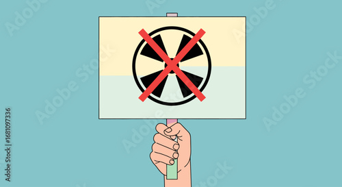 A hand holding a sign protesting against nuclear power, a symbol crossed out.