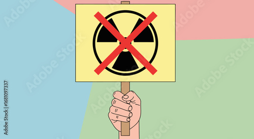 Hand holding a protest sign against nuclear energy.