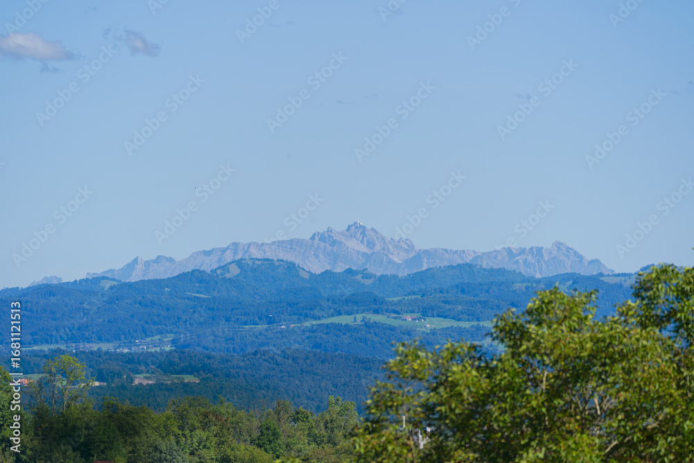 Obraz premium Scenic view of Glatt valley with Alpstein mountains in the background seen from Swiss city of Zürich on a sunny summer day. Photo taken August 31st, 2025, Zurich Schwamendingen, Switzerland.