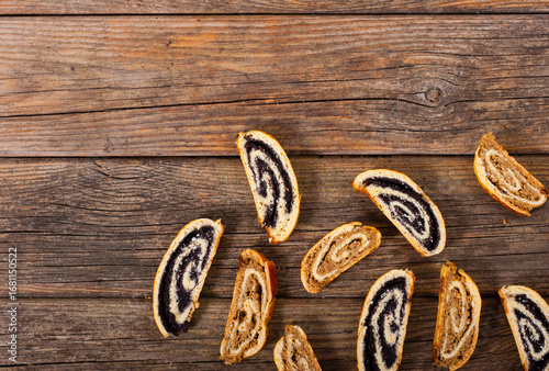 poppy and walnut roll cakes, old wood table, christmas and easter traditional east european dessert