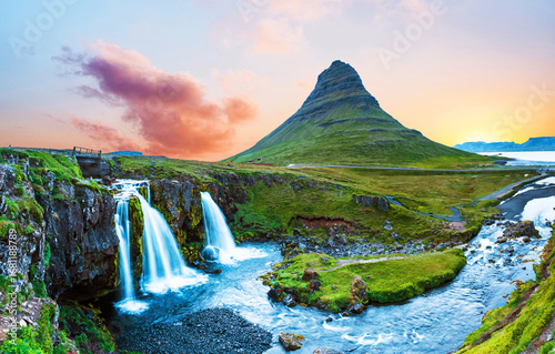 Beautiful natural magical scenery with a waterfall Kirkjufell near the volcano in Iceland. Exotic countries. Amazing places. Popular tourist atraction. (Meditation, antistress - concept).